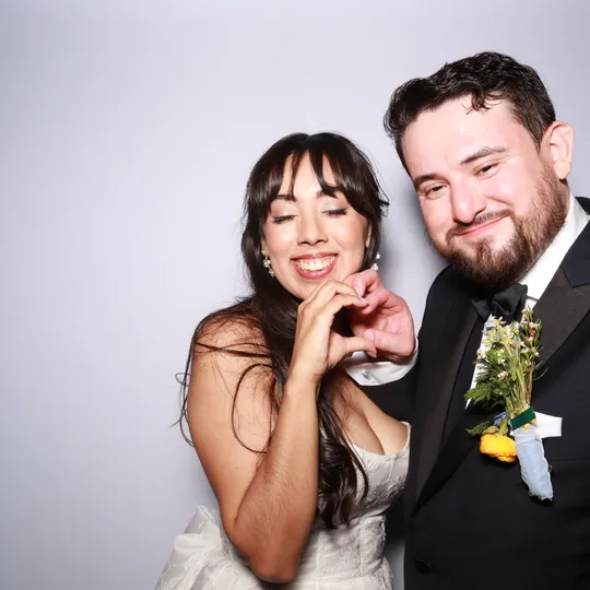 Cynthia and Nathan at their Antiquité wedding reception photo booth