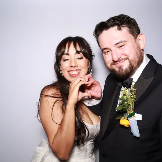Cynthia and Nathan at their Antiquité wedding reception photo booth