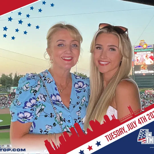 Guests at the Fourth on the Field photo booth at Sutter Health Park